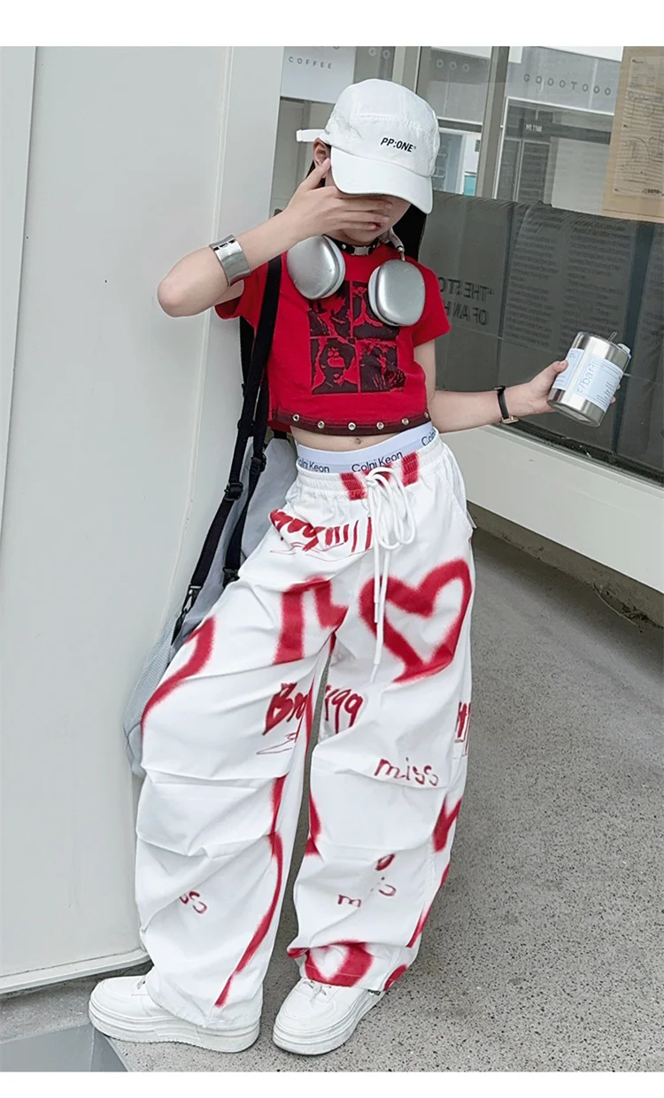 Kinder Hip-Hop Modehose mit Kordelzug und Zeichnungen für Teenager-Mädchen Coole Y2K Streetwear-Hose mit Herz-Graffiti 5-14 Jahre – Detail 11
