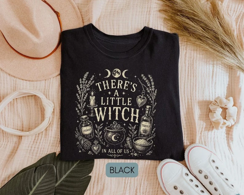 For the little witch within—supplies, fantasy-gothic style clothing, and Halloween items. Unisex streetwear shirt.