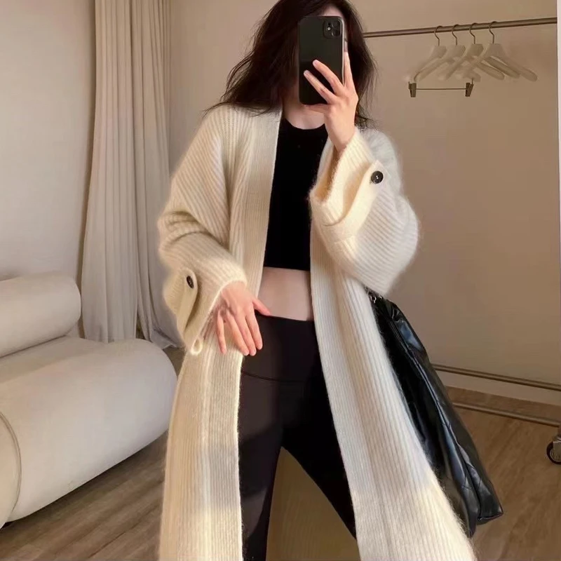 المرأة طويلة الأكمام سترة مشغولة من الصوف سترة 2025 الخريف الشتاء معاطف الموضة بلون المتضخم زر طويل جاكيتات الملابس