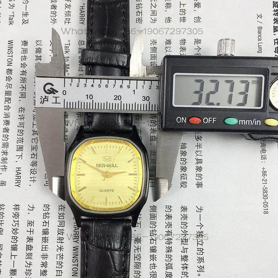 Original stock, Tianjin Seagull brand square black shell strip nail yellow quartz watch, diameter 31mm