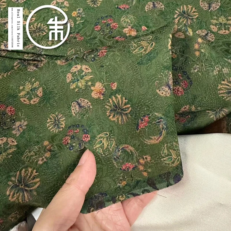 

High Quality Emerald Green Floral Full Hole Xiangyun Yarn Chinese Style Real Silk Designer Silk Fabric 30momme Cloth