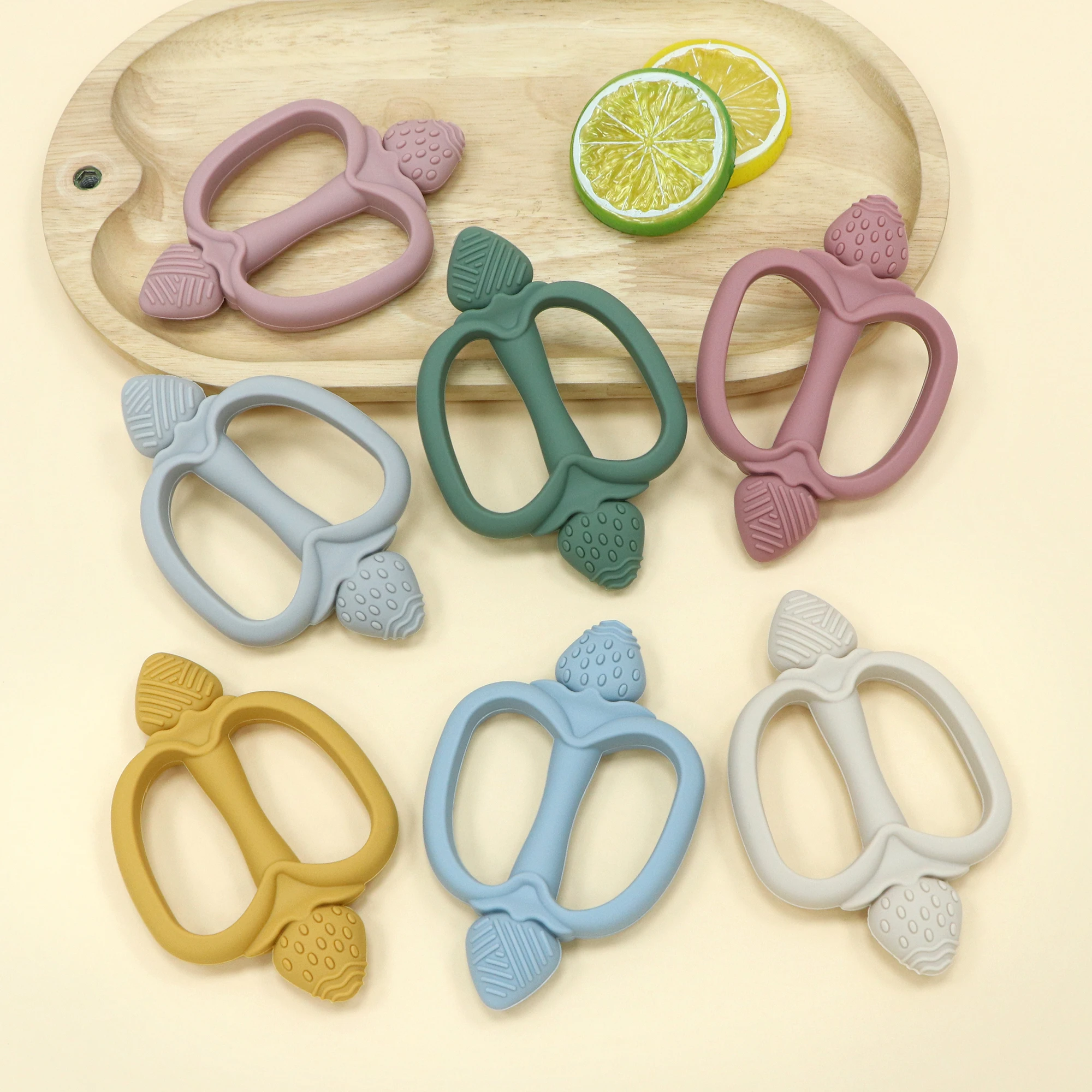 Easy-grip baby teether, strawberry-shaped teether, multi-textured design, food-grade silicone, BPA-free, a great newborn gift.