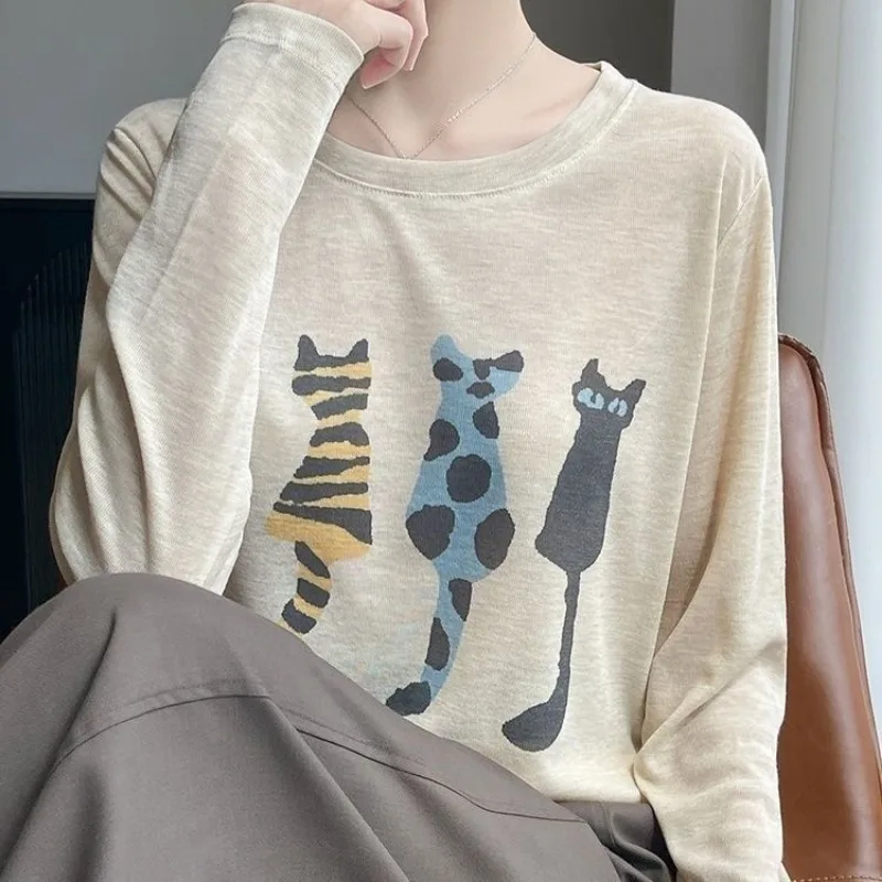 

2025 женский новый стильный сращенный пуловер с круглым вырезом и принтом, модный свободный и универсальный повседневный вязаный топ с длинными рукавами