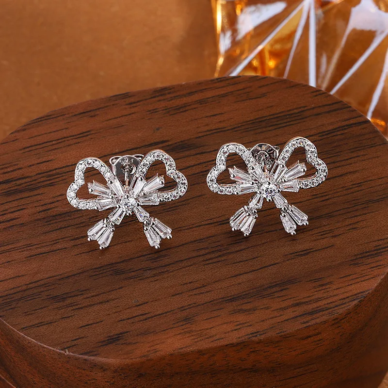 

Exquisite S925 Sterling Silver Hollow Bow Flower Stud Earrings Ladies Niche Design Gift Jewelry