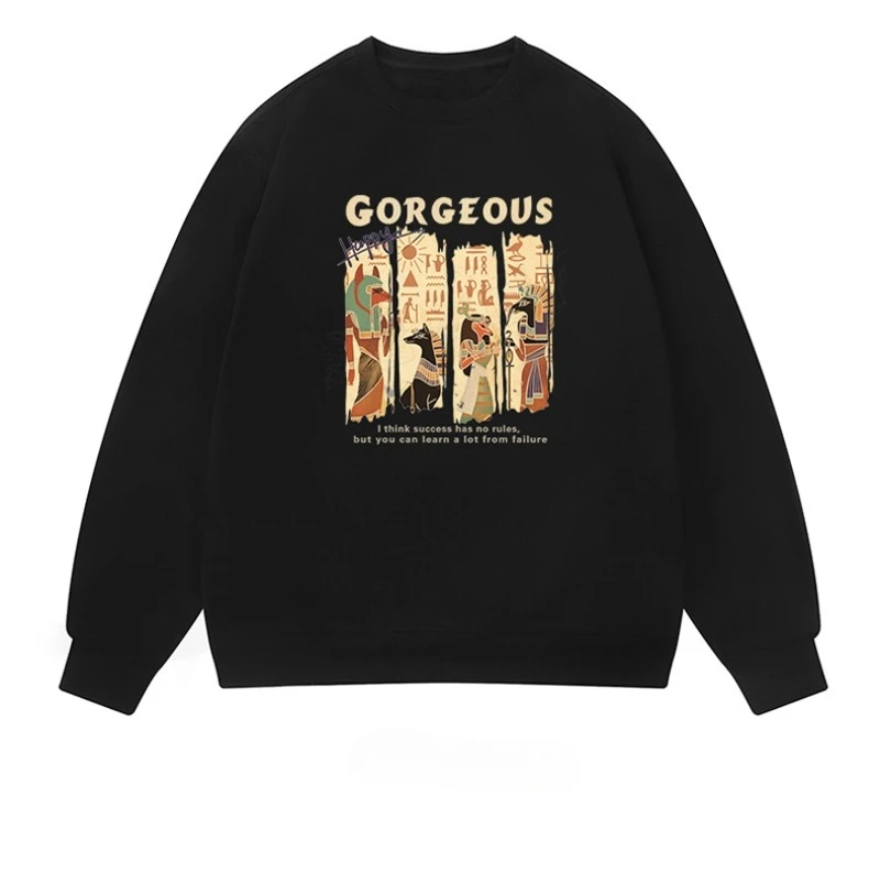 

A stylish and loose men's and women's top with Egyptian totem print for the autumn/winter 2025 collection