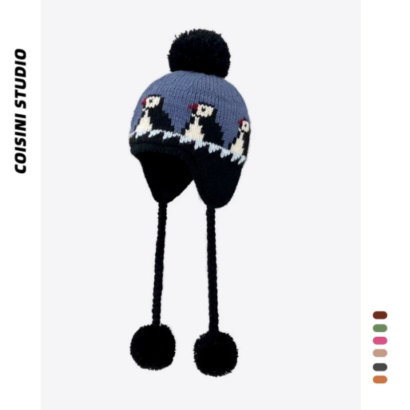Gorro de punto con protección para los oídos de Jacquard de pingüino de dibujos animados coreano para hombres y mujeres, gorros de bombardero con cordones y bolas de pelo cálidas para invierno