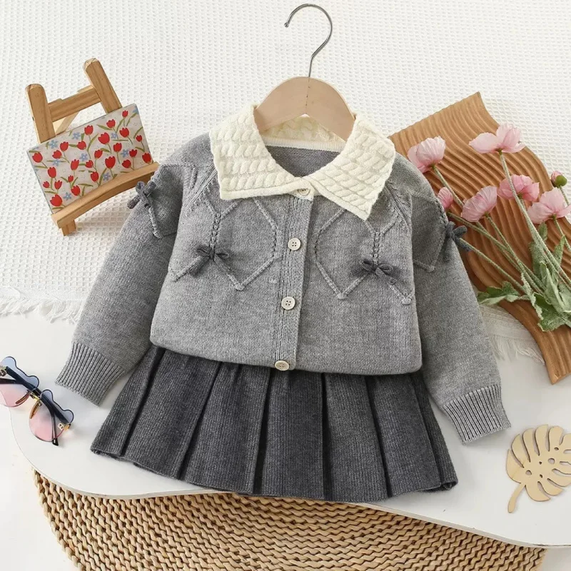 A.Girls'  New College Style Knitted Korean Version Fashionable Reversed Collar Cardigan Top and Skirt Two-Piece Set