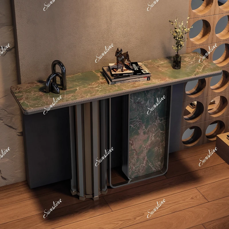 Italian light luxury stainless steel console table against the wall to enter the door directly opposite the door