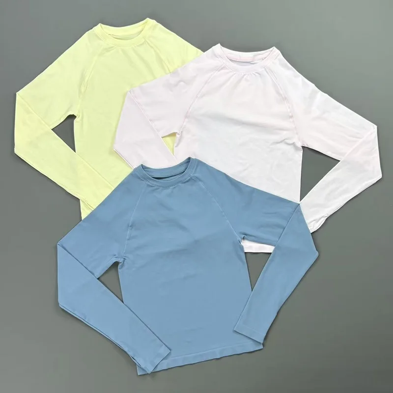 Haut de sport respirant et élastique à manches longues pour femme, col rond, sans coutures, coupe ajustée, idéal pour le yoga, la gym, le Pilates et le fitness