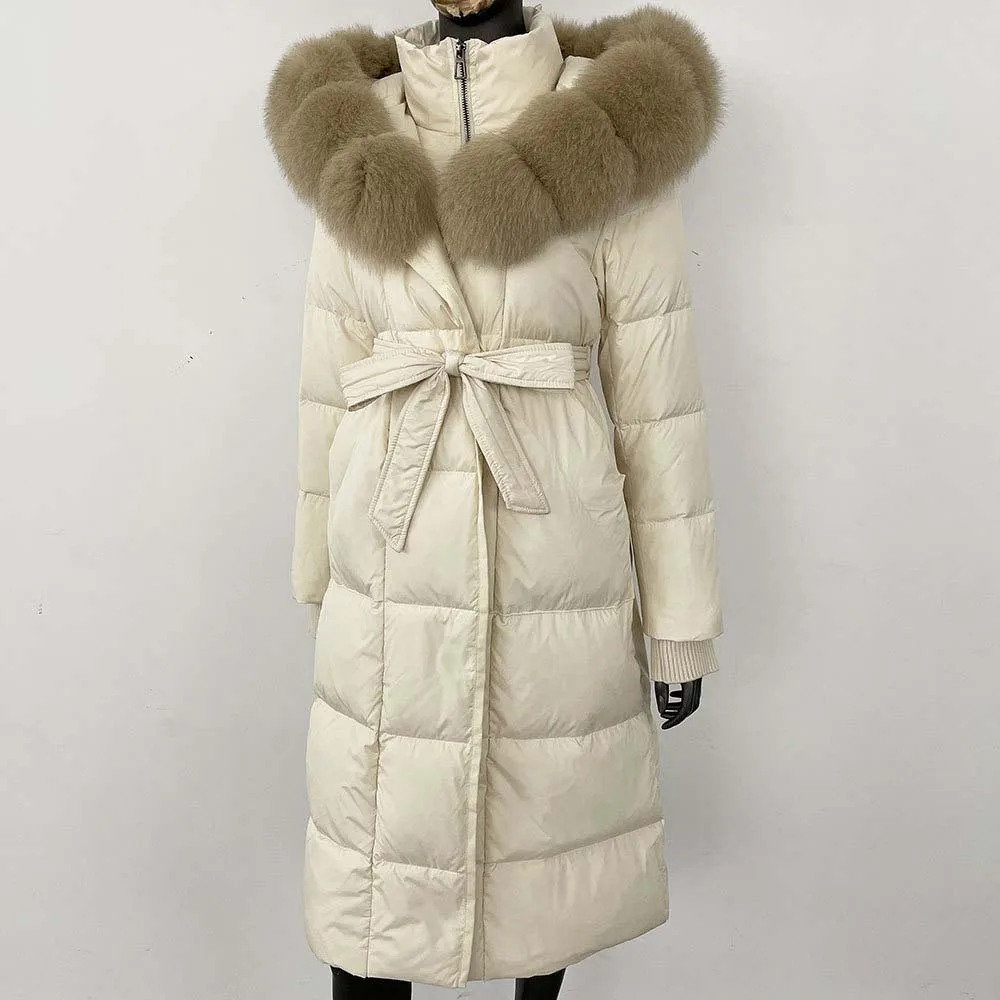 เสื้อแจ็คเก็ตพัฟเฟอร์แบบมีฮู้ดยาว ปี 2025 สำหรับผู้หญิง รุ่นใหม่ ฤดูหนาว อุ่นสบาย ขนห่านสีขาวแท้ พร้อมขนสุนัขจิ้งจอกแท้