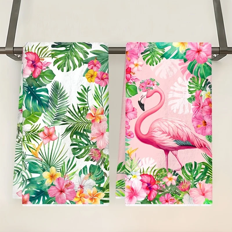 Two Hawaiian-themed kitchen towels featuring flamingos, Monstra leaves, and red floral designs