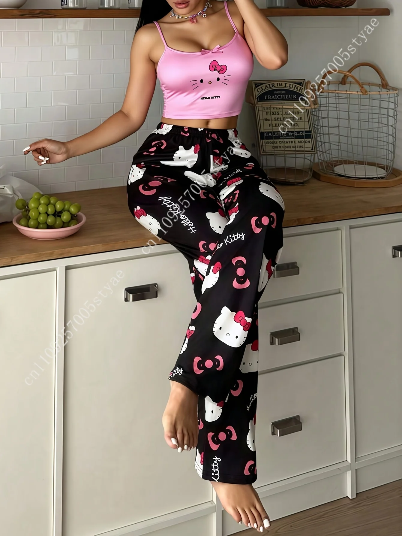 2pcs Sanrio Hello Kitty Pajama Set Features A Women'S Halter Neck Top with An Off The Shoulder Style and Black Pants view 2