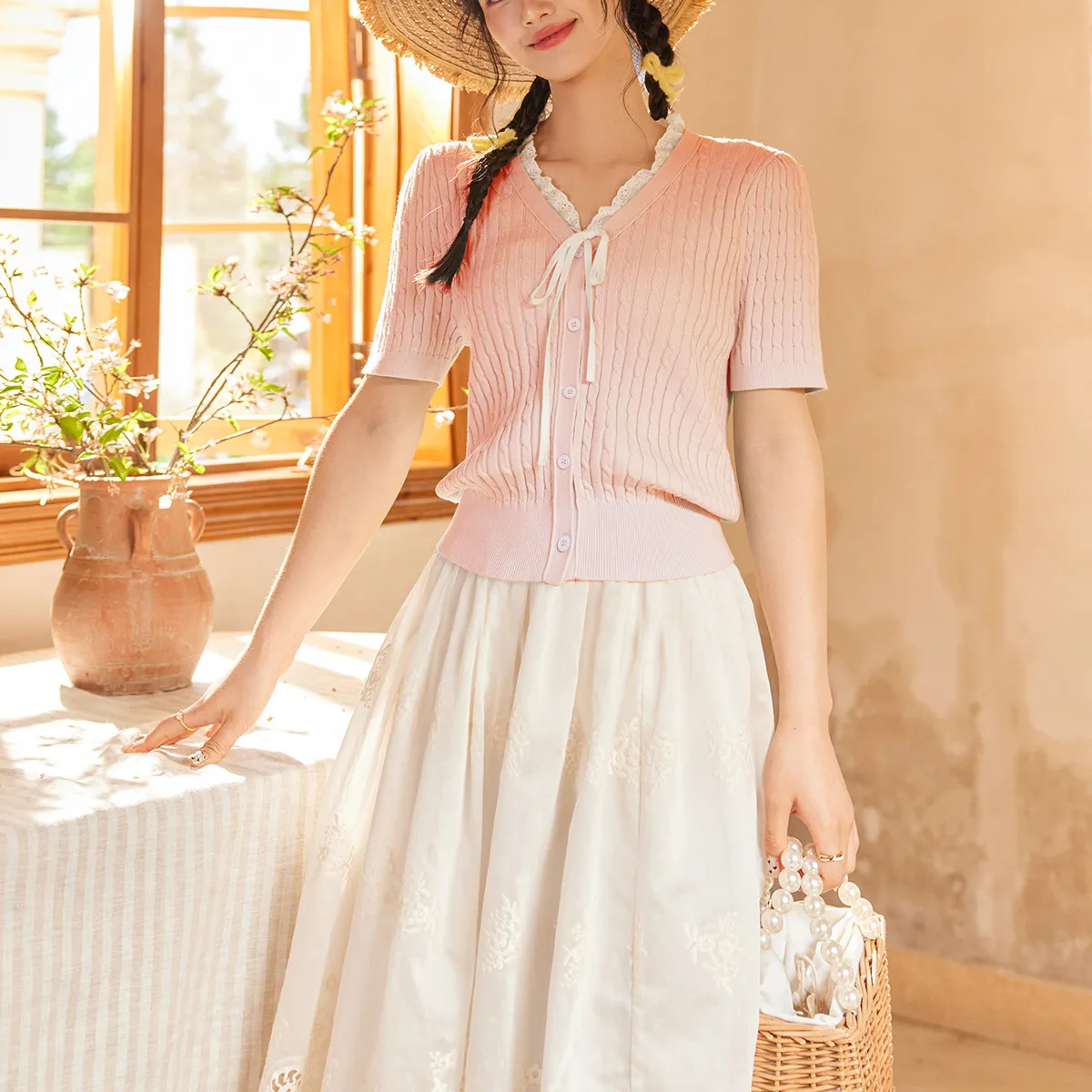 Spring and summer - slimming and covering up. Lace-trimmed V-neck knitted sweater with short sleeves and open front top.