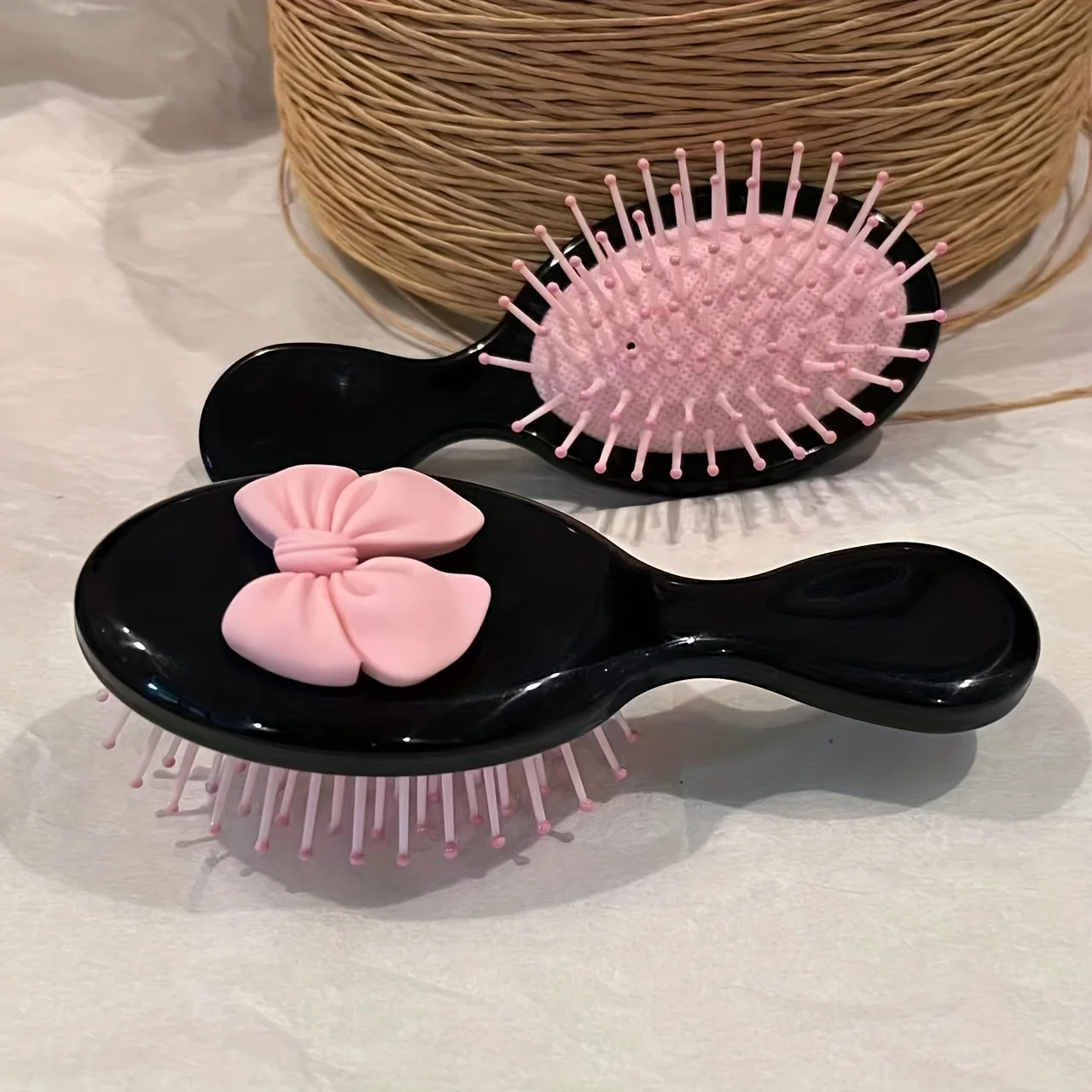 Niedliche Mini-Haarbürste mit Schleife – tragbarer, faltbarer Kissenkamm mit Airbag, Massage-Haarbürste mit rosa Schleifen-Design, Haar-Styling-Werkzeug