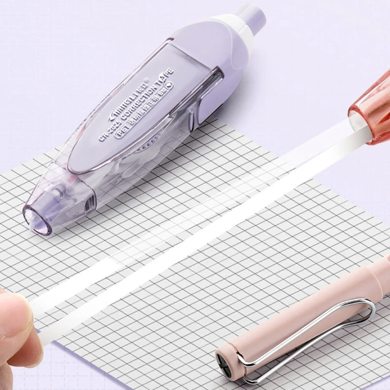 Presionando cinta correctora correcta, cinta correctora blanca, material oficina escolar