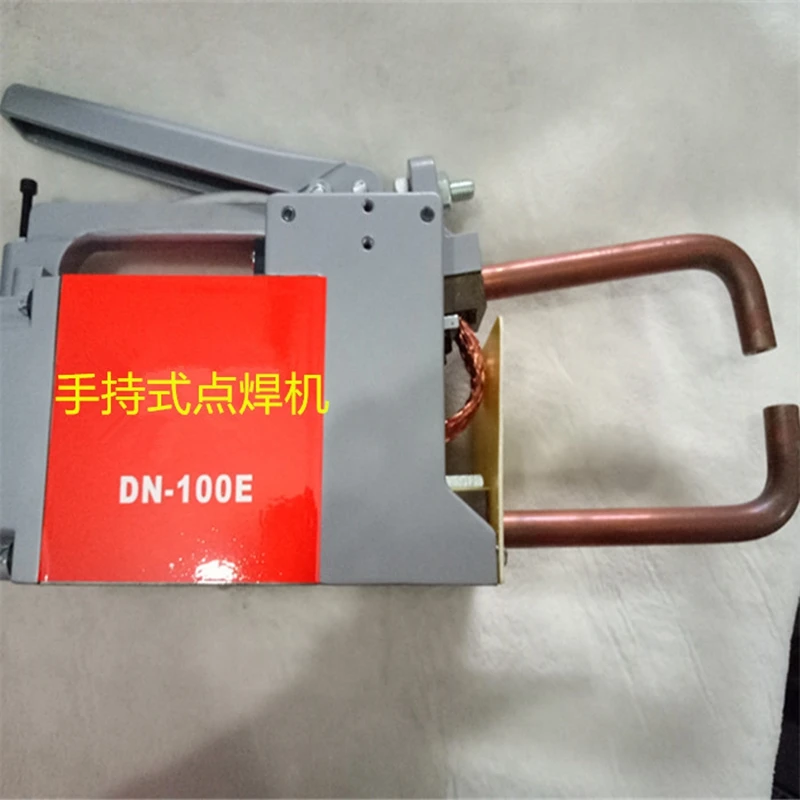 DN-100E มือถือ Spot เครื่องเชื่อมมือถือเหล็ก Plat Joint แบบพกพาจุดเชื่อมเครื่องสะพานสูบลมเข็มขัดการเชื่อมต่อ