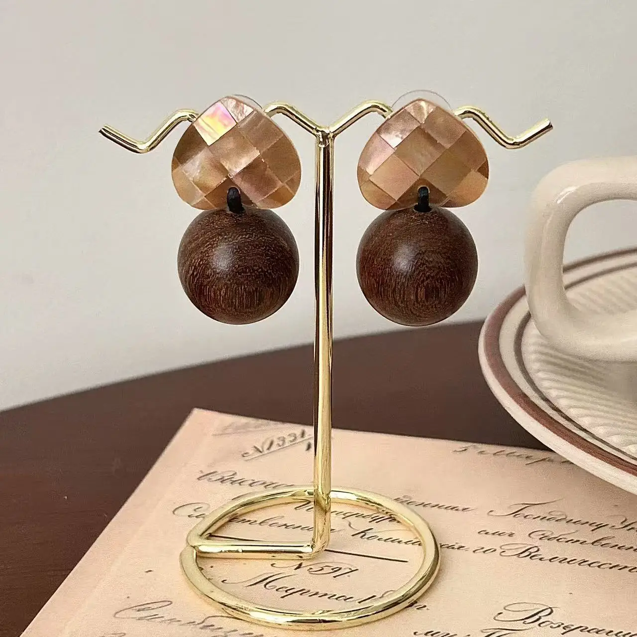 Retro log ball splicing Fritillary stud earrings women's antique natural shell earrings niche Mori literary earrings