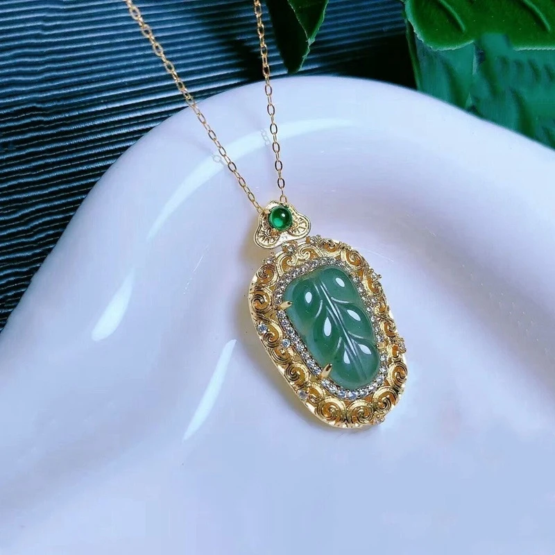 

Natural A-grade jade leaf pendant necklace with copper inlay and traditional Chinese hollow-carved design, direct supply