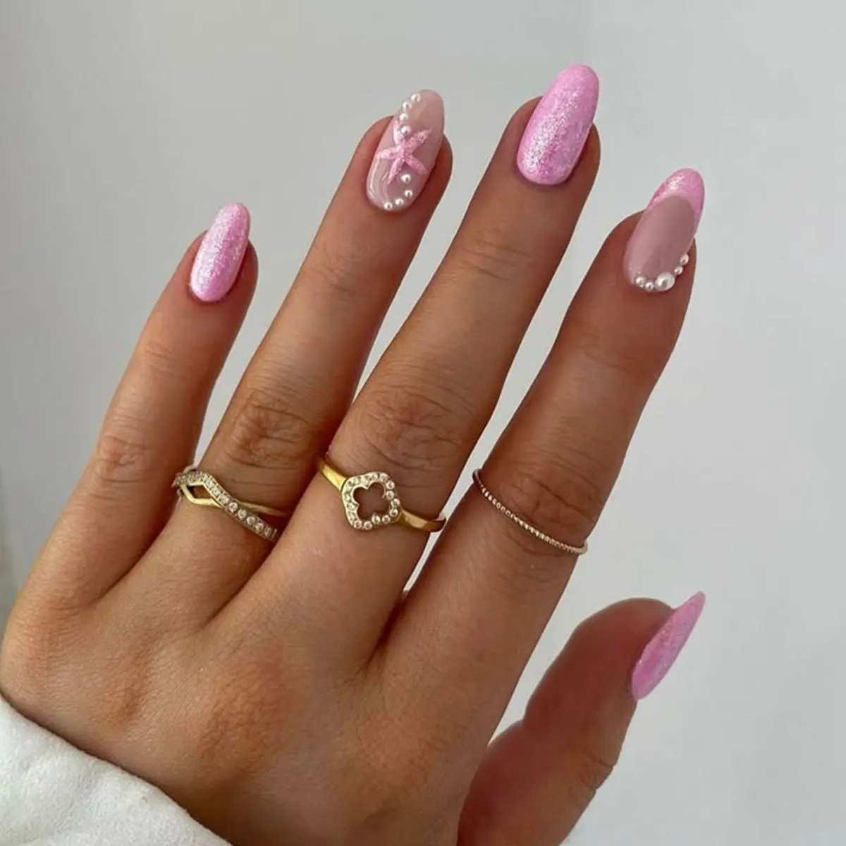 

24Pcs Mid-length Almond Fake Nails Press on Pink Shiny Powder French False Nails with Star Pearl Wearable Full Cover Nails Tips