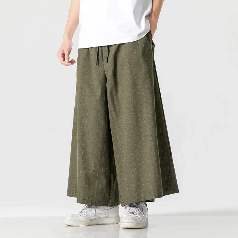 الرجال الكورية الأزياء بنطال ذو قصة أرجل واسعة 2025 رجل أسود فضفاض عادية سراويلي حريمي اليابانية الشارع الشهير ركض مخطط السراويل الرجعية 5Xl