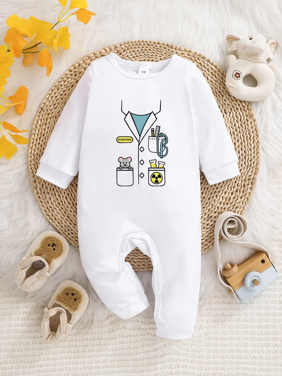 A baby long-sleeved onesie with interesting letter prints. It features a buttoned design for easy putting on and taking off, and