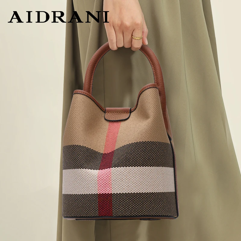 Aidrani Women\'s plaid handbag, made of canvas and cowhide material, with a caramel colored large capacity and a small bag inside