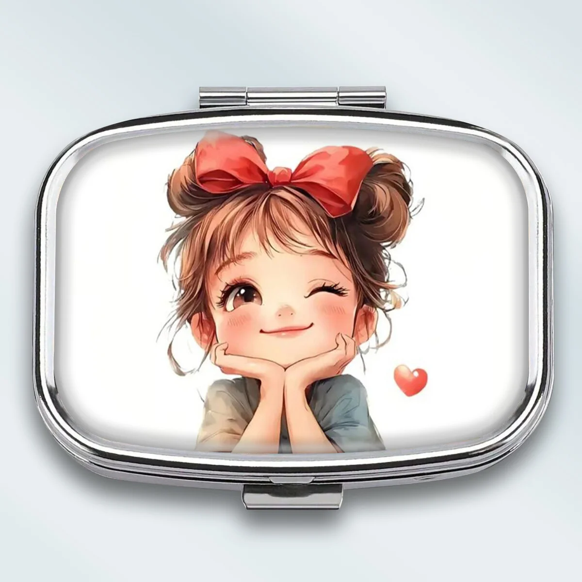 A Portable Square Metal Pill Box with a Playful Wink-Wink Lady Theme, Featuring 2 Compartments, Perfect for Elegantly Storing Your Medications or Supplements. It Is Perfect for Sorting Vitamins and Storing Small Items.