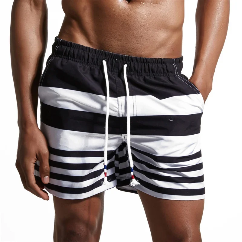 Pantaloncini da spiaggia con motivo a strisce colorate per uomo Cuciture colorate Costume da bagno stampato in 3D Pantaloncini da surf estivi Hawaii Pantaloni corti larghi