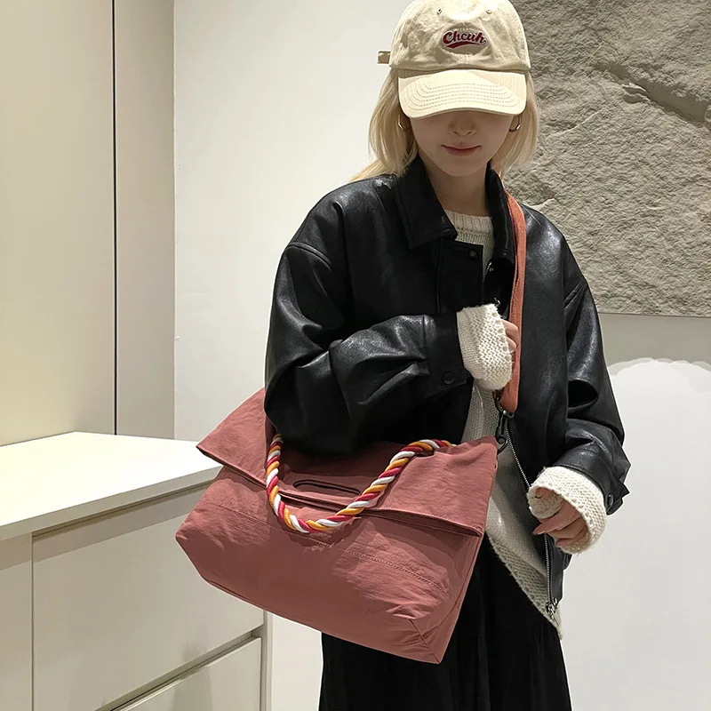 

New niche women's thick rope nylon cloth large capacity commuting versatile messenger shoulder shopping bag designer luxury bag