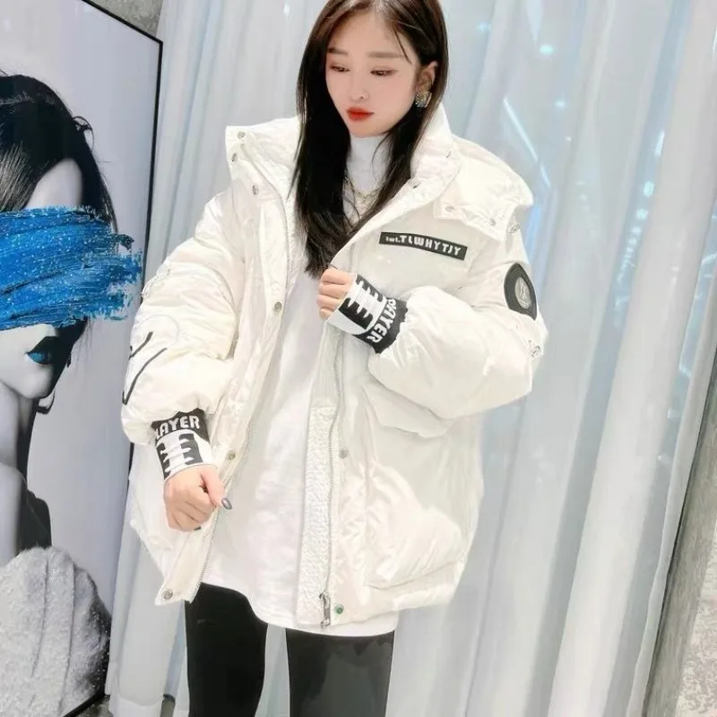 Nueva versión coreana de invierno, chaqueta de plumón brillante para mujer, chaqueta de plumón de pato blanco pequeña con capucha, color amarillo, personalidad Simple