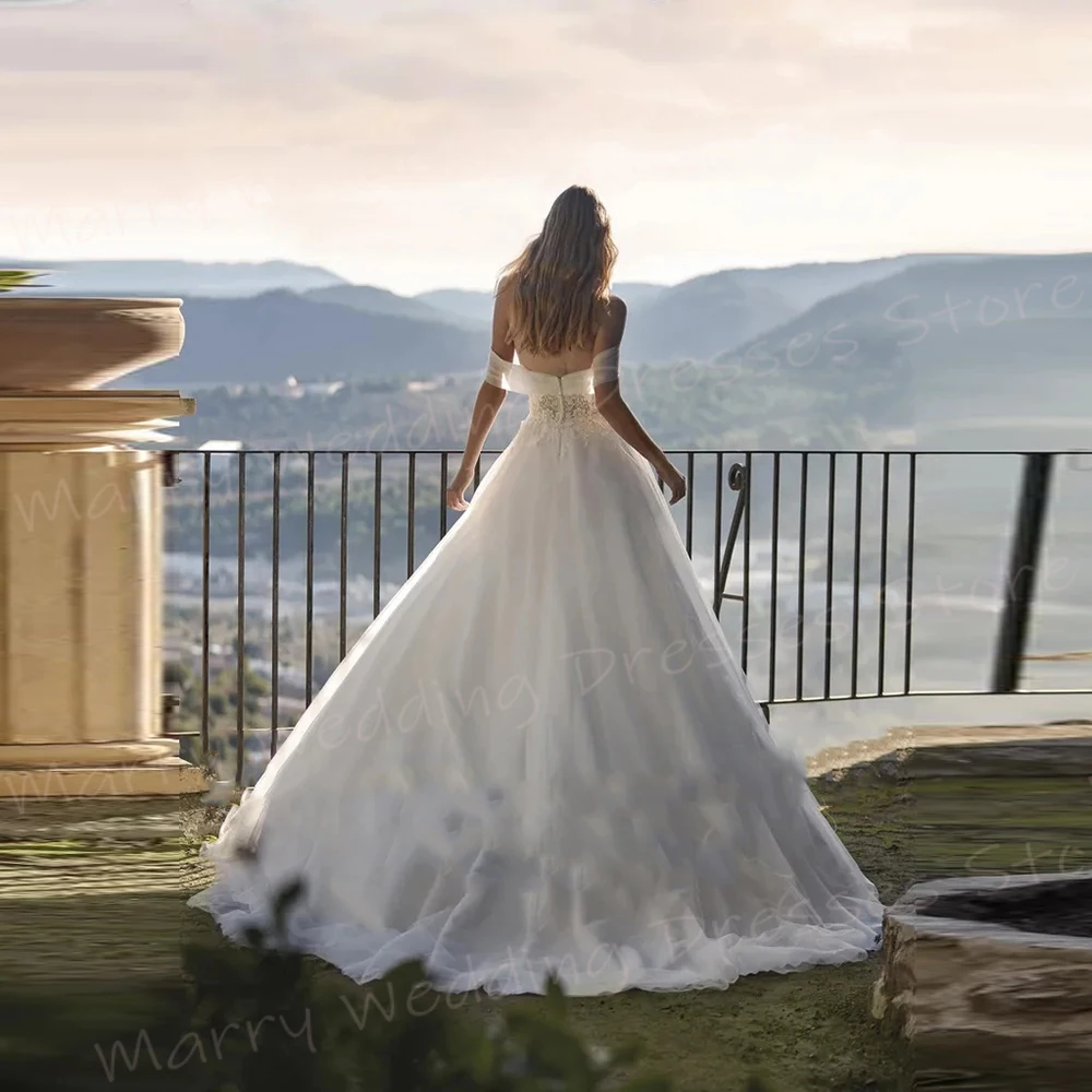 Bellissimi abiti da sposa da donna A Line affascinanti Appliques abiti da sposa in pizzo moderni con spalle scoperte abiti da sposa senza schienale