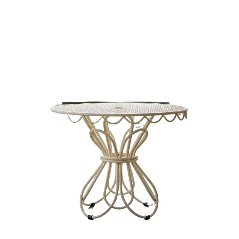 Modern outdoor French style round metal bistro table with wavy edge details and a perforated mesh top