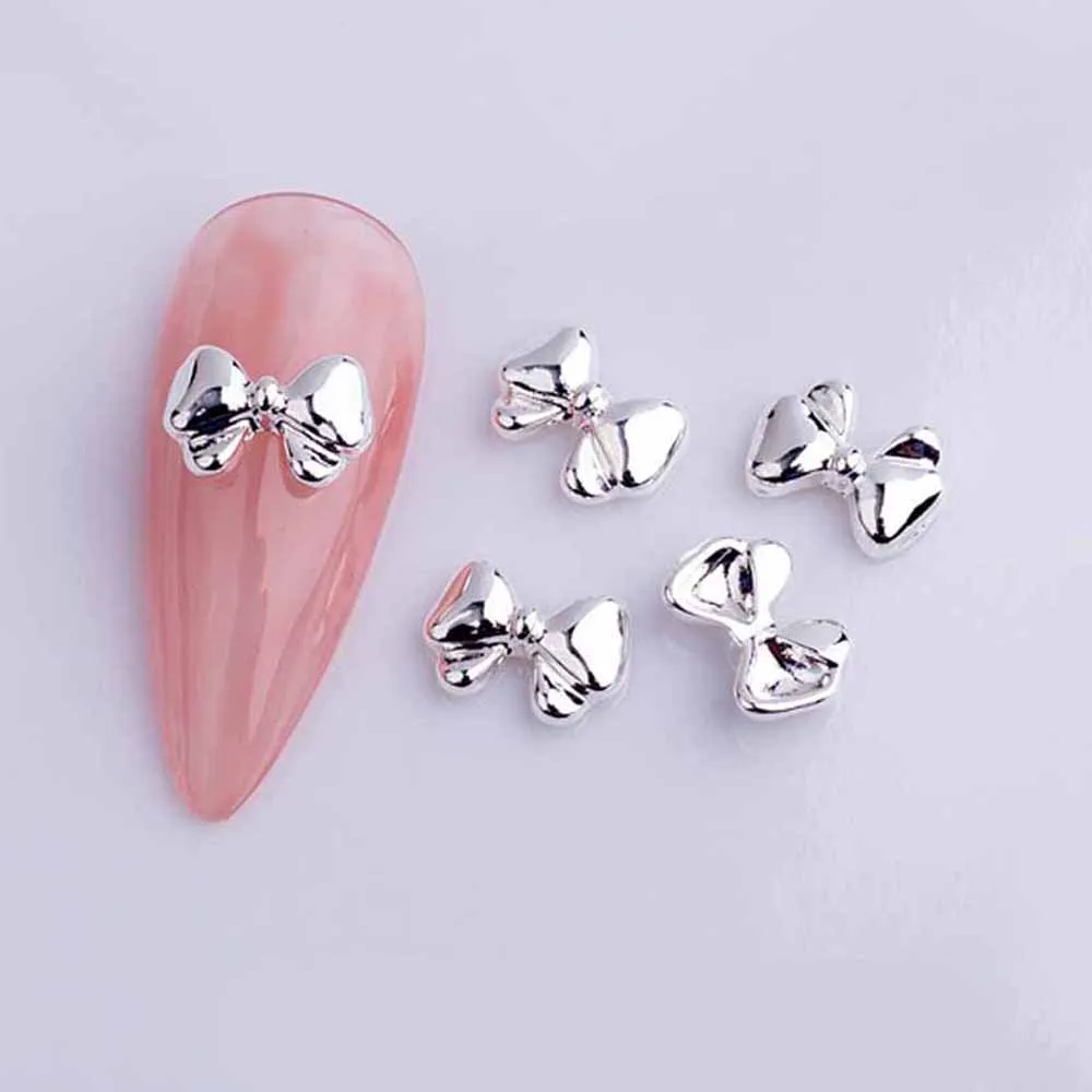 Nœuds de ruban en alliage pour Nail Art, breloque 3D or/argent, Mini nœud papillon creux, pièces de décoration d'ongles, bricolage, Design japonais, 20 pièces