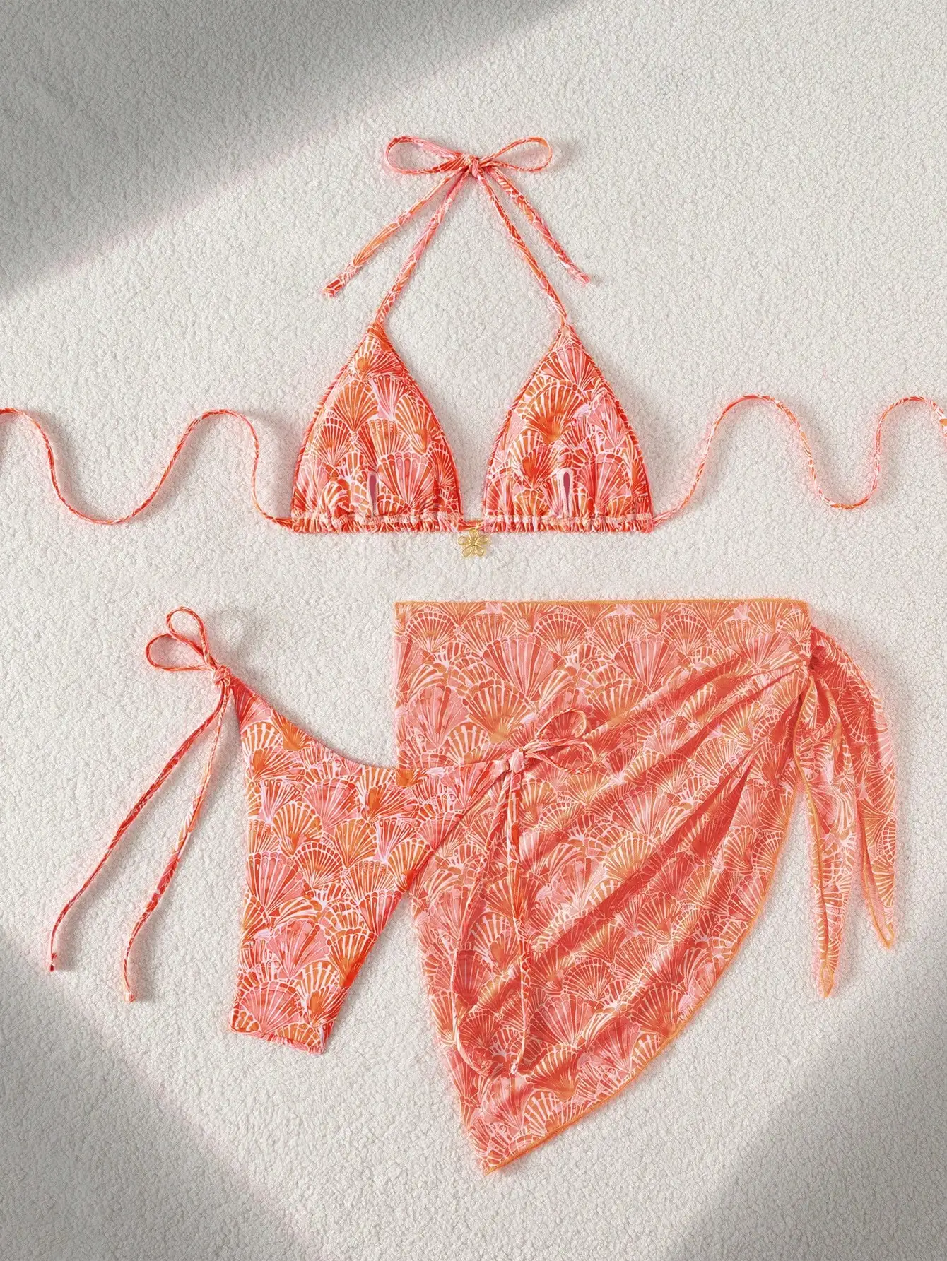 

Coral Orange Seashell Pattern Triangle Halter Bikini With Side Tie Bottoms And Matching Sheer Cover Up Skirt