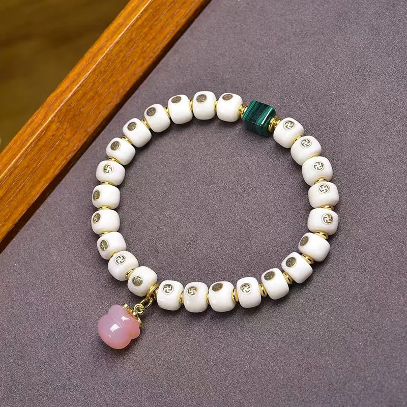 - handcrafted bone-inlaid bracelet with swastika barrel , single-loop Tibetan-style agate string beads and mala