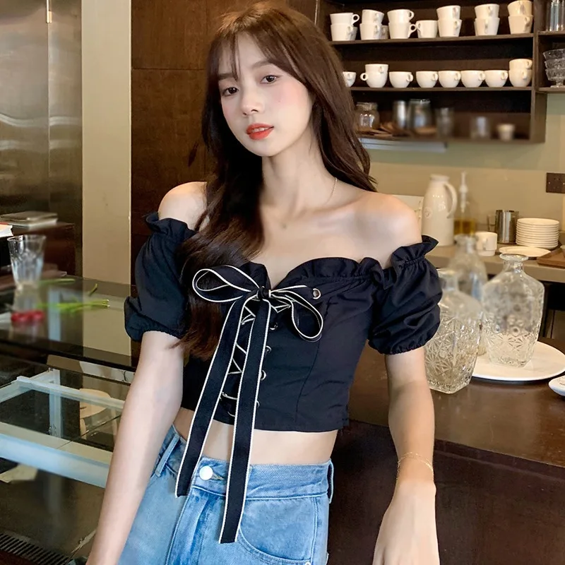 Frauen Bluse sexy süße Puff Ärmel schnüren ausgesetzt Nabel koreanischen Slash Neck Frühling Sommer vielseitige Top vielseitige Top