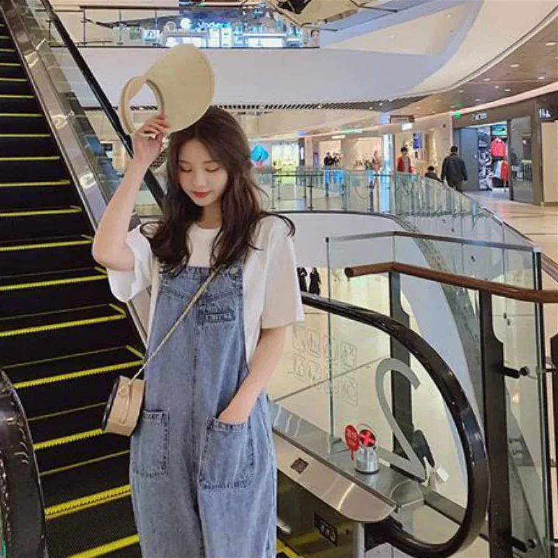 Tute da donna Salopette blu lavata in denim stile coreano Pantaloni larghi casual Pagliaccetti da donna con tasca Vintage Spring Chic femminile