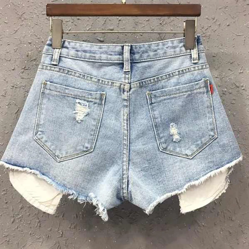 Persönlichkeit Loch Blau Denim Shorts Frauen Sommer Neue Hohe Taille Lose Breite Bein Hot Pants High Street Dame Mode Mini Jeans