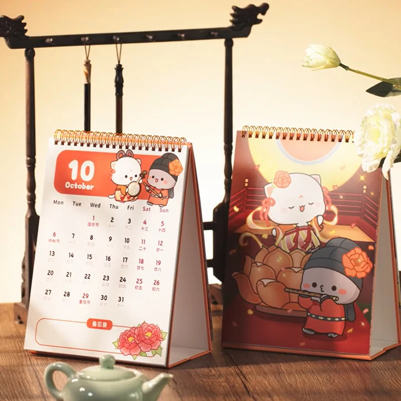 Disponibile 2025 Nuovo originale Mitao Cat Cultura cinese Serie Calendario Modello carino Miele Pesca Gatto Calendario da lavoro desktop Regalo