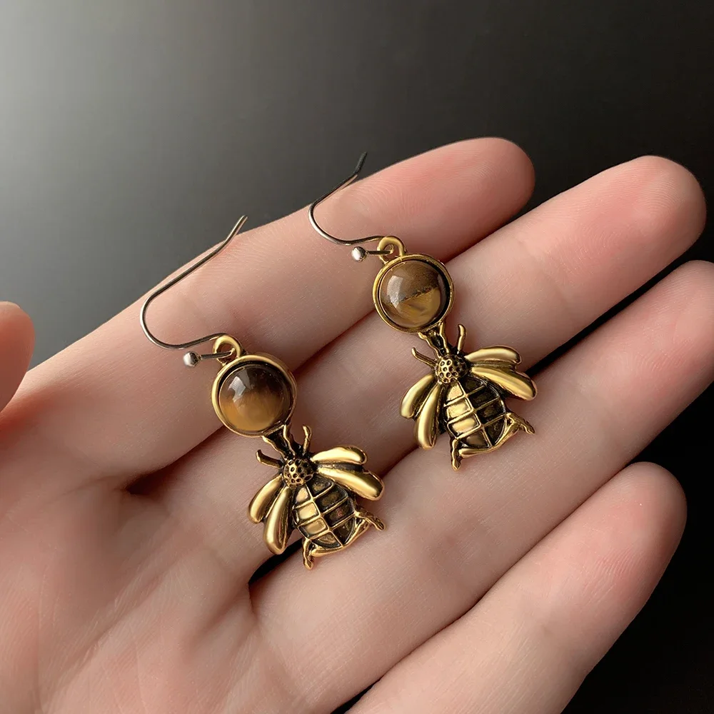 A pair of cute retro fashion little bee honey earrings for women's daily accessories decoration