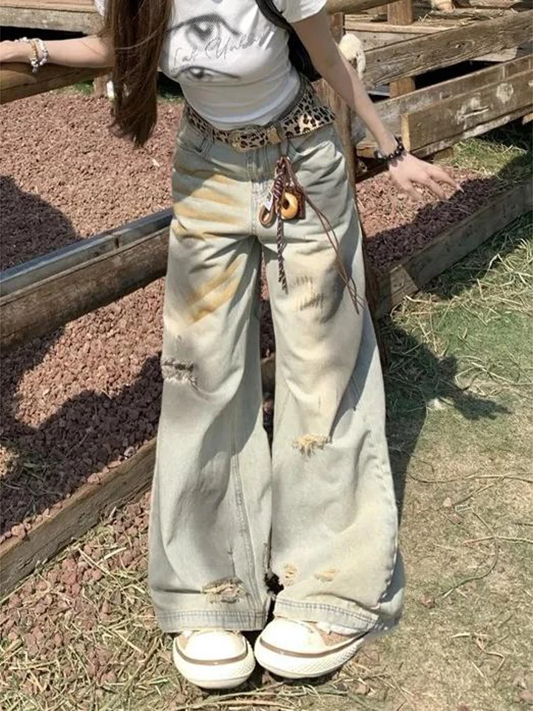 Amerikaanse stijl retro noodlijdende gele modder vuile geverfde jeans dames lente herfst 2025, ontwerpgevoel gescheurde broek met wijde pijpen