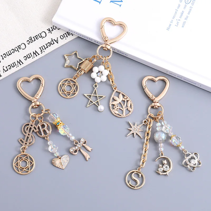 Nuevos llaveros colgantes con tachuelas de diamantes, estrella de cinco puntas, bolso con lazo de gatito, accesorio para artículo de moda, colgante decorativo