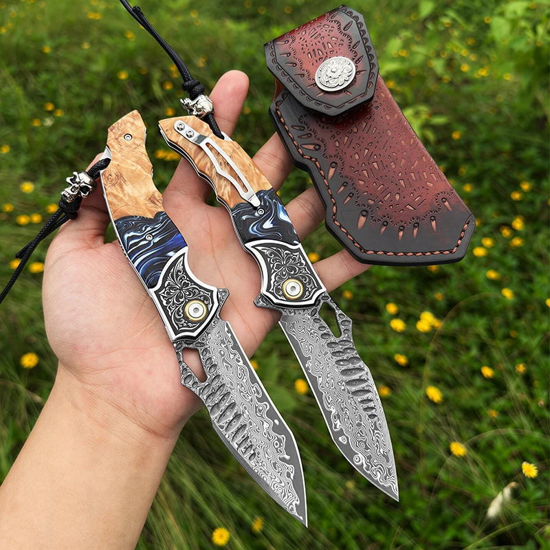 Handcrafted VG10 Damascus steel folding pocket knife with a maple wood handle featuring a random-patterned resin inlay and a cowhide sheath—a premium men’s everyday carry (EDC) gift designed specifically for outdoor enthusiasts.
