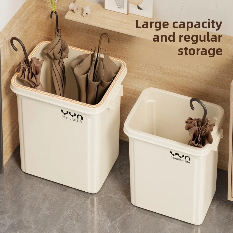 

Umbrella holder placed next to the entrance door for storing and draining umbrellas, suitable for commercial use in companies an
