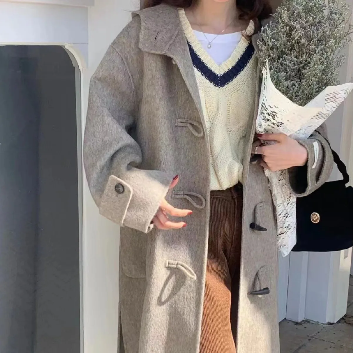 

Long-haired baby camel wool horn buckle double-sided wool coat for women's 2023 new hooded high-end temperament woolen coat