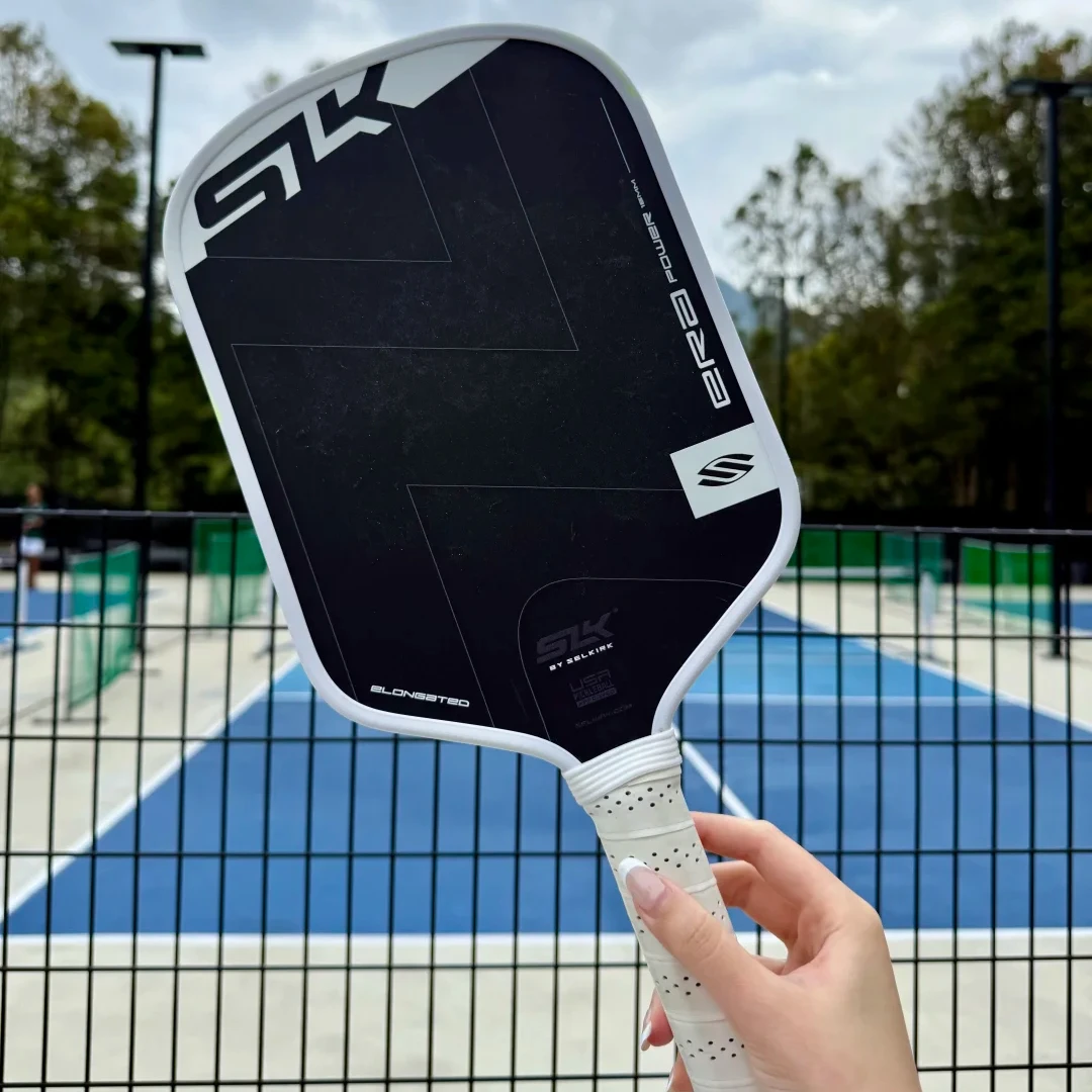 

Ракетки для пиклбола SLK ERA Power 16 мм: гибридная поверхность из углеродного волокна T700 и стекловолокна, динамический сердечник Fusion, высокий вращательный момент, большой Sweet Spot