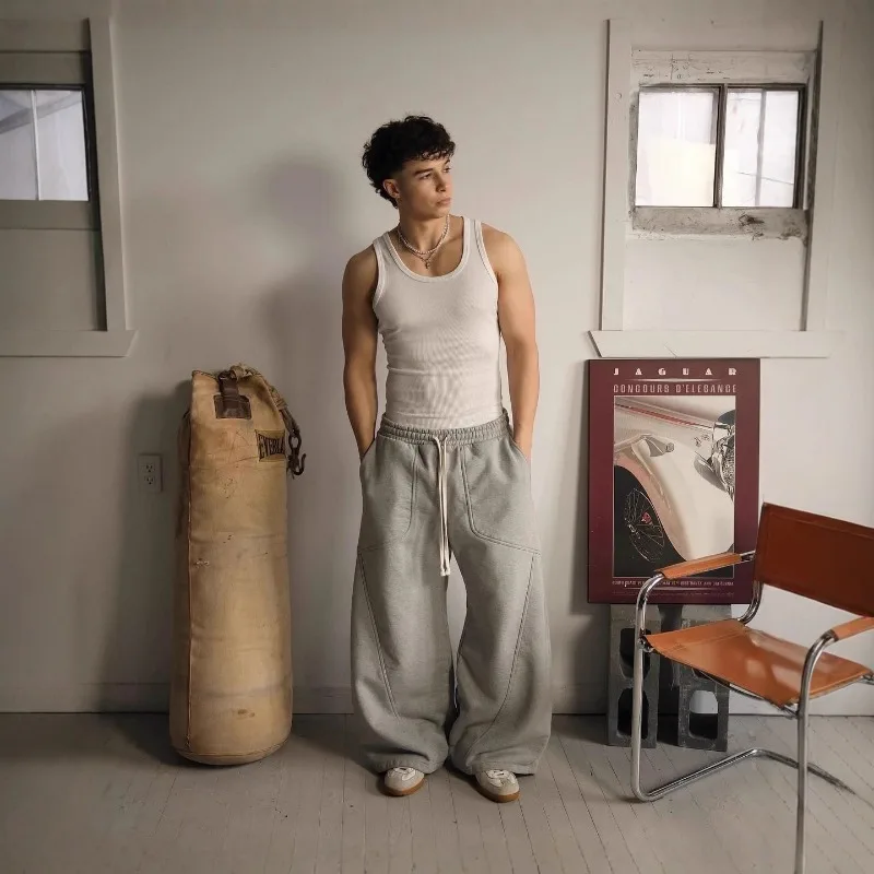 Pantalones de chándal con cordón y patrón bordado de estilo americano para hombres y mujeres, pantalones informales sueltos de pierna ancha de Hip-hop de calle alta para parejas