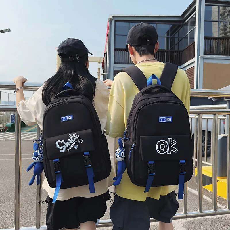 Eine trend ige und coole Schüler-Schult asche, koreanische Version, Brief-Paar-Rucksack mit großer Kapazität, Computer-Rucksack im Freien