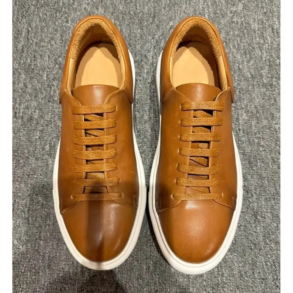 Caramel Brown Burnished Leather Sneakers, with matching laces and white sole, stylish and versatile