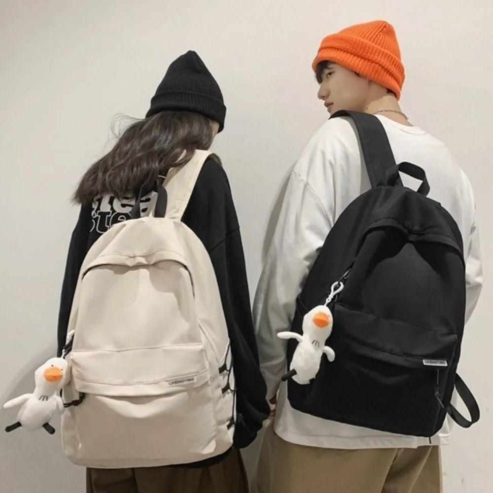 大容量バックパック カジュアルルック ペンダント付き 学生用スクールバッグ 防水 日本風 ティーン向け ナイロン製ブックバッグ